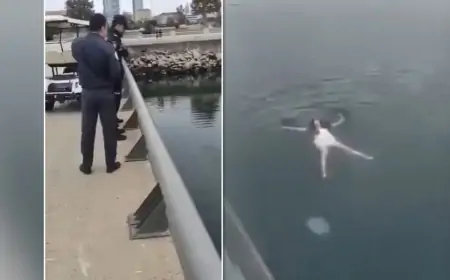 Bulvarda paltarla dənizdə üzən qadın kimdir?