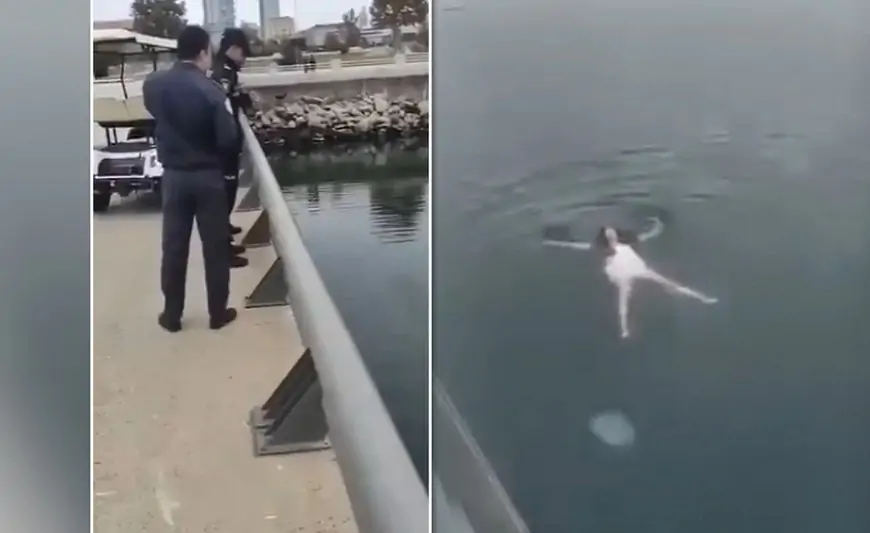 Bulvarda paltarla dənizdə üzən qadın kimdir? - VİDEO